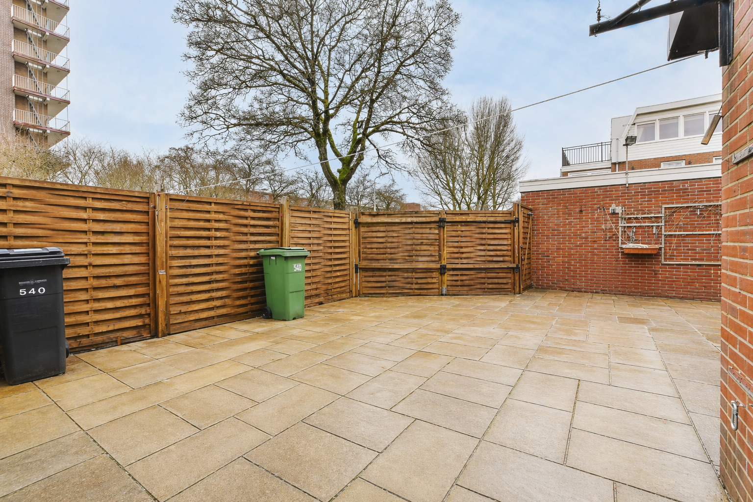 Cleaned patio with restored paving after professional pressure washing service in Derby